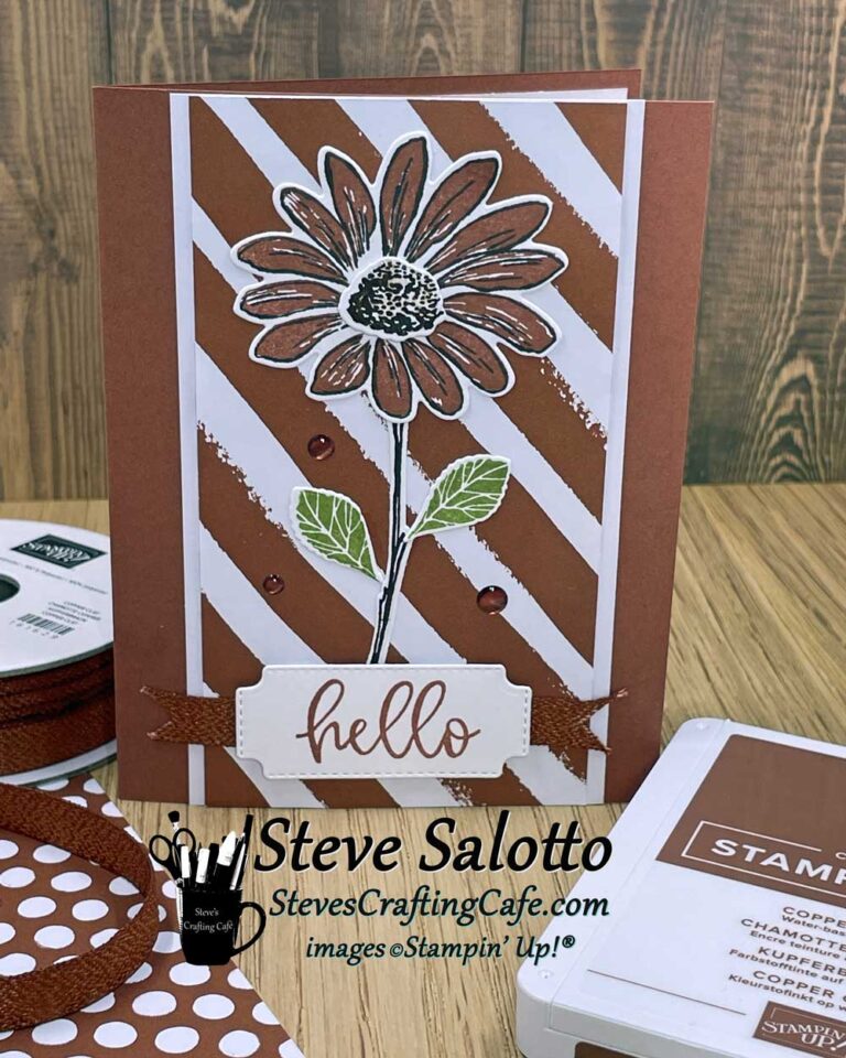 A greeting card with a copper daisy on it that says "hello"