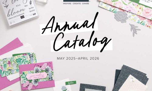 Various cards and card making supplies lie on a white craft table, surrounding the words, "Stampin' Up! Annual Catalog May 2025 - April 2026"