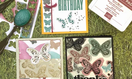 Three greeting cards with butterfly designs on them.