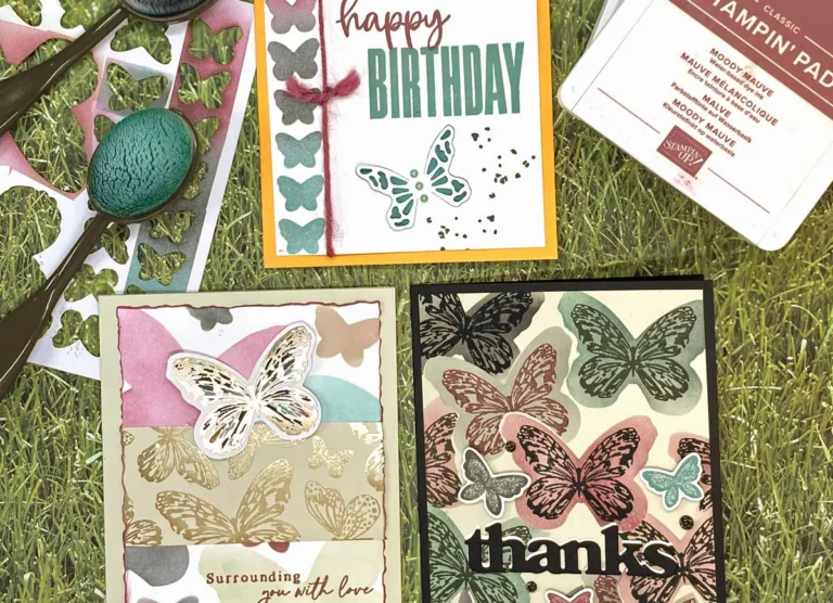 Three greeting cards with butterfly designs on them.