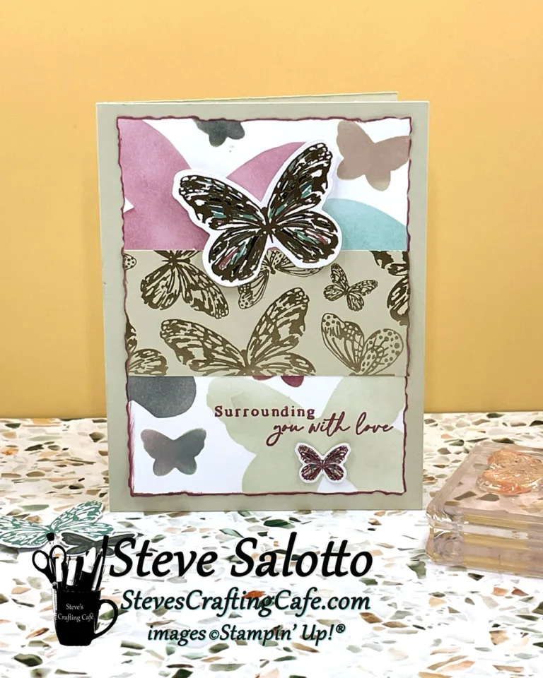 A greeting card with muted warm colors has blended ink butterflies as well as stamped and die cut ones. It says "Thanks."