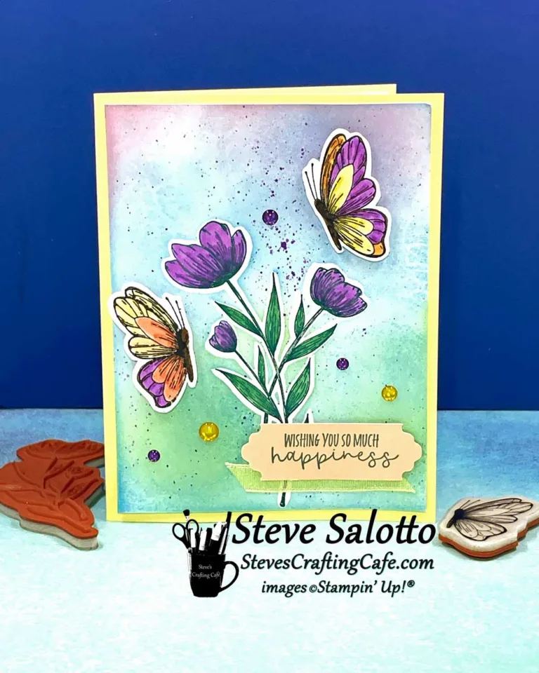 Teo butterflies hover over flowers on a handmade greeting card that says, "wishing you so much happiness."