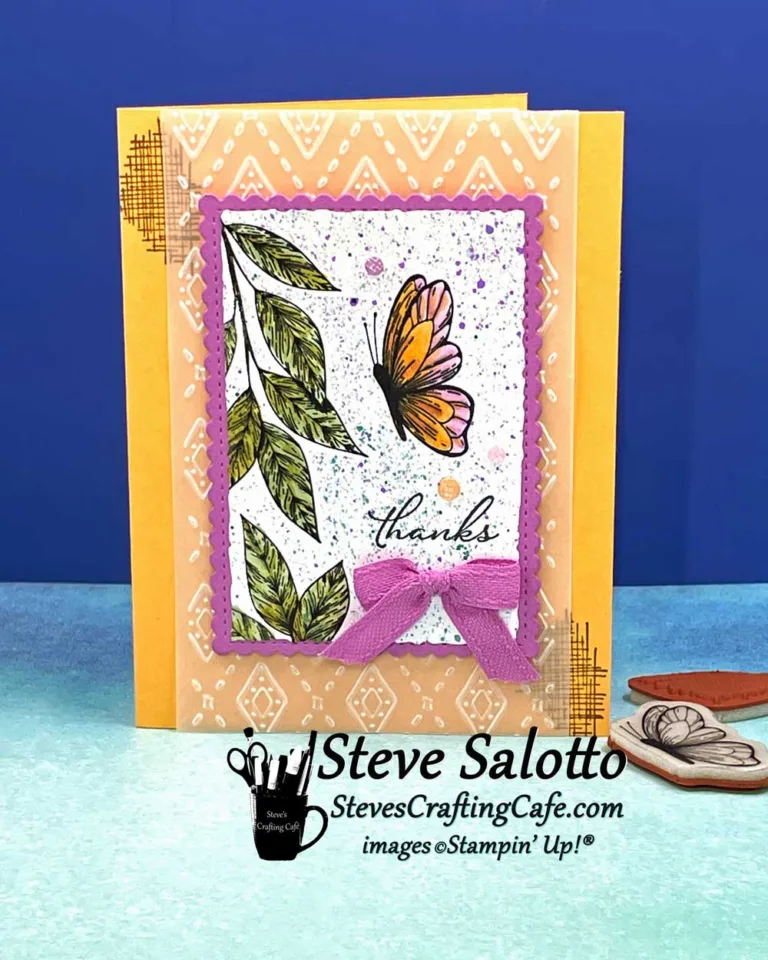 A greeting card that says "thanks" and has a butterfly hovering near leaves stamped and colored on it.