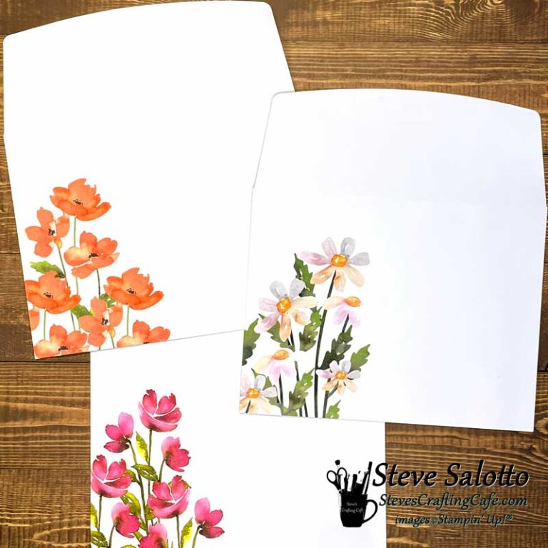 Three envelopes with watercolor pictures of flowers on them.