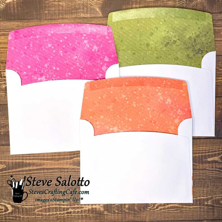 The insides of three envelopes with patterned liners in pink, green and orange.