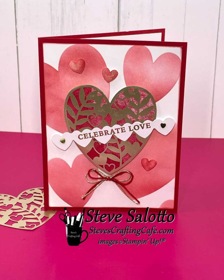 A red and pink Valentine's Day card with various hearts on it and a sentiment that reads "Celebrate Love."