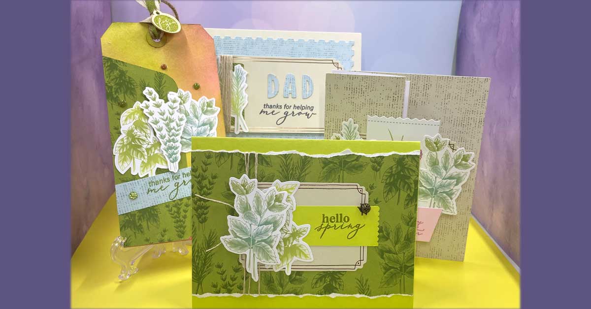 Several greeting cards with spring themes sit in front of a blue background.