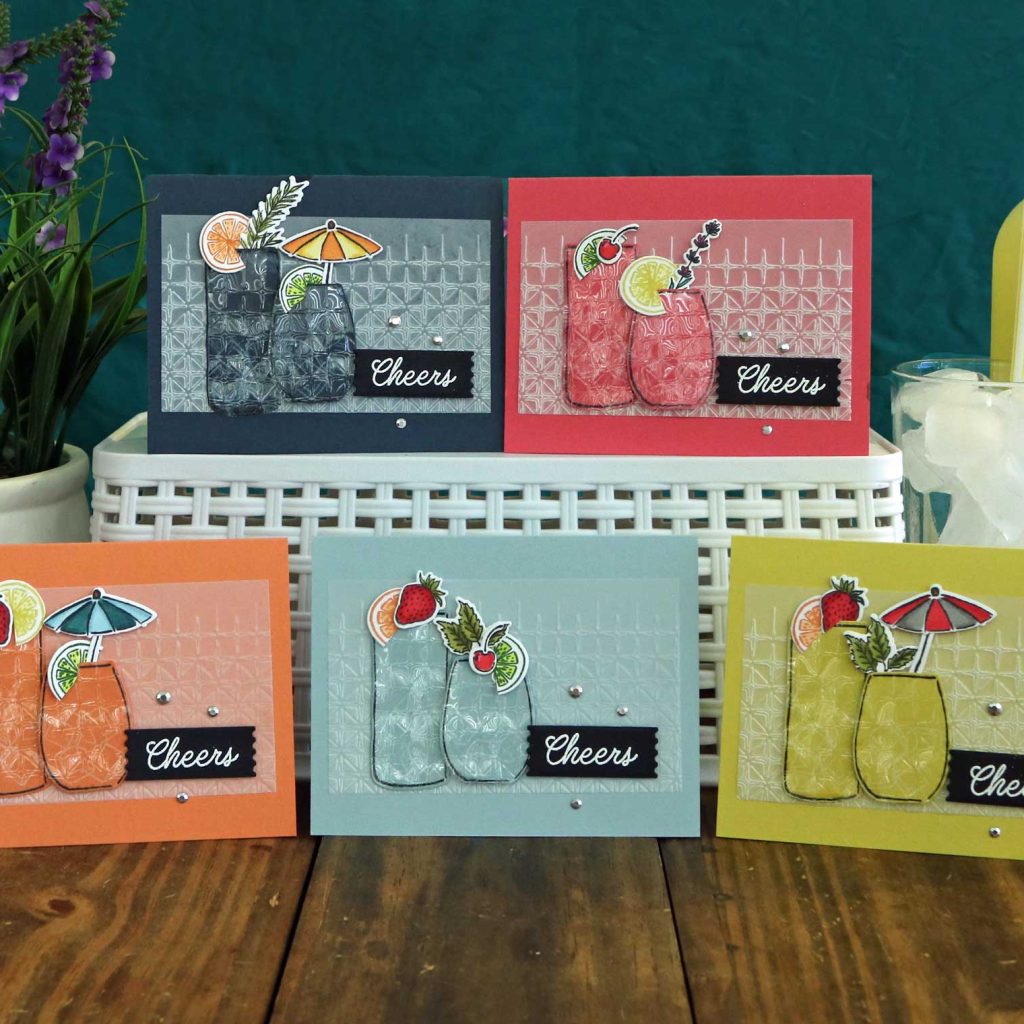 Five matching greeting cards in various colors and the sentiment, "Cheers!"