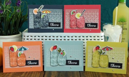 Five matching greeting cards in various colors and the sentiment, "Cheers!"