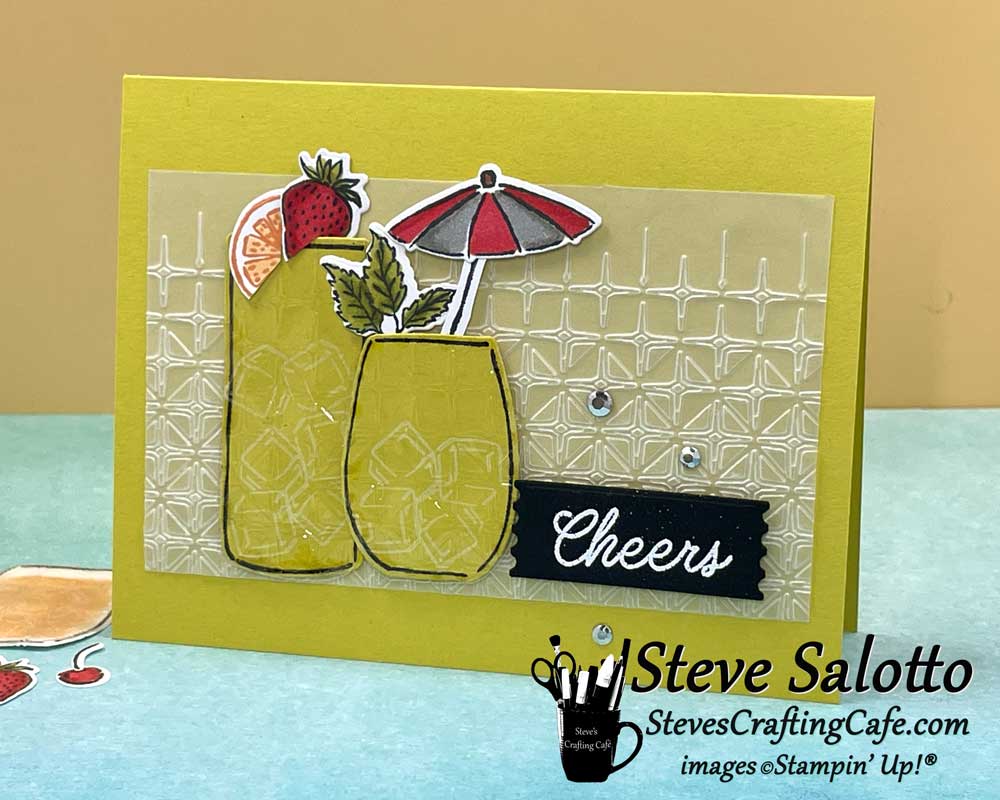A yellow card with two cocktails on it and the sentiment, "Cheers"