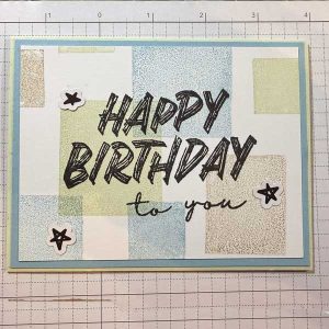 A Happy Birthday card with color blocks as the background.