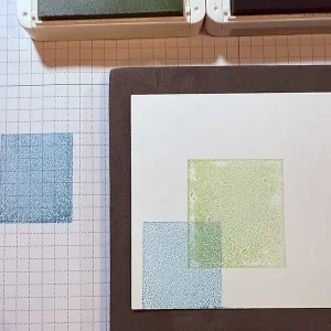 Colord blocks are stamped on white card stock.