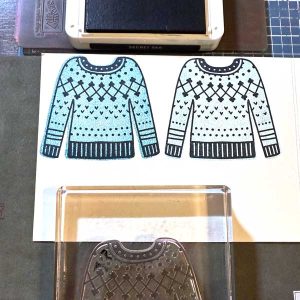 Line art has been added over the solid image by using the other side of the sweater stamp.