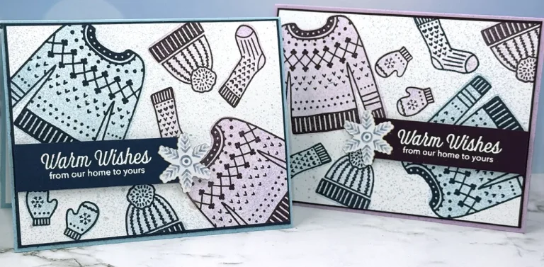 2 greeting cards with stamped images of sweaters, hats, socks and mittens. Sentiments read, "Warm Wishes from our home to yours."
