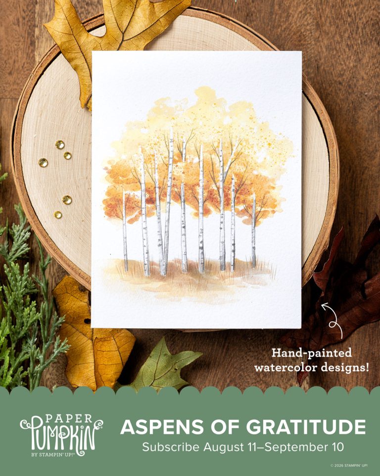 A greeting card with trees on it sits on a tree stump. Under it is written, "Aspens of Gratitude."