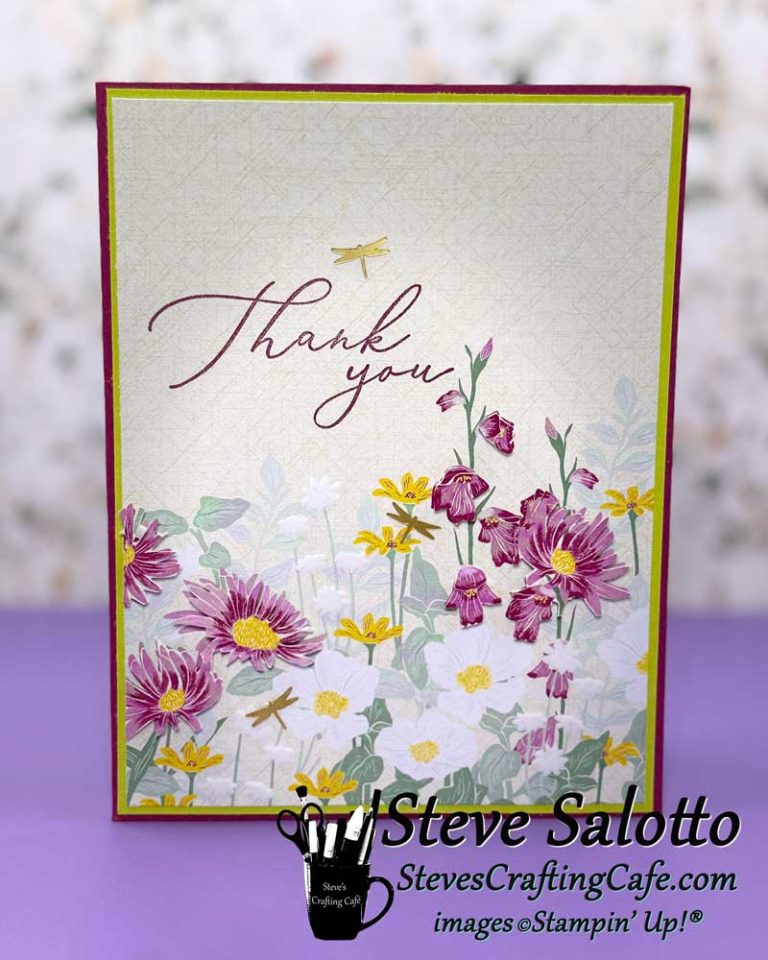 A greeting card with purple, white, and yellow flowers and a sentiment saying, "Thank you."