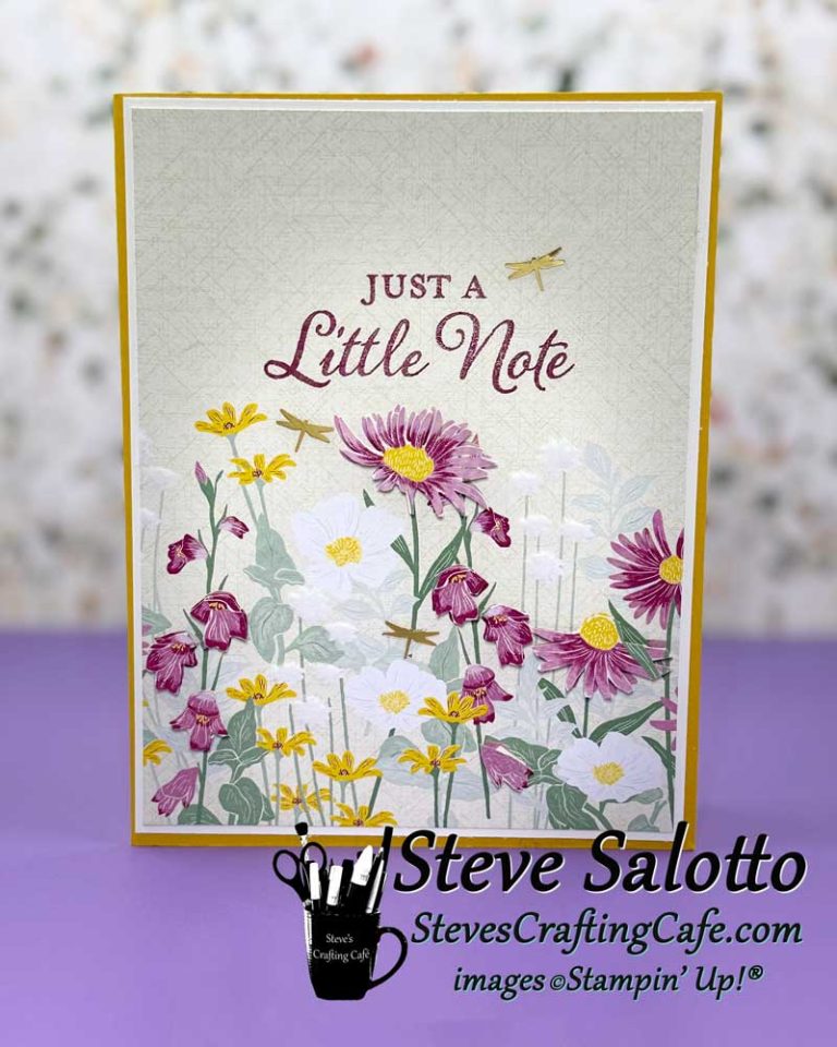 A greeting card with purple, white, and yellow flowers and sentiment saying, "Just a little note"
