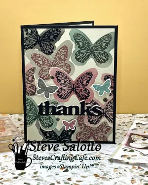 A greeting card with butterfly images and "thanks" on the front.
