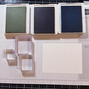 Supplies Three open ink pads with three acrylic blocks and a blank white card front.