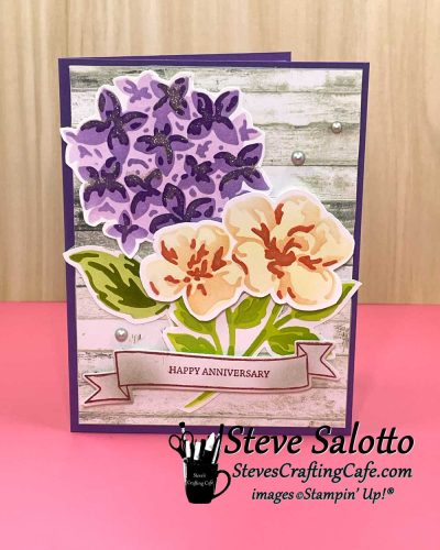 A greeting card with ink-blended purple and orange flowers on it and the sentiment, "Happy Anniversary."