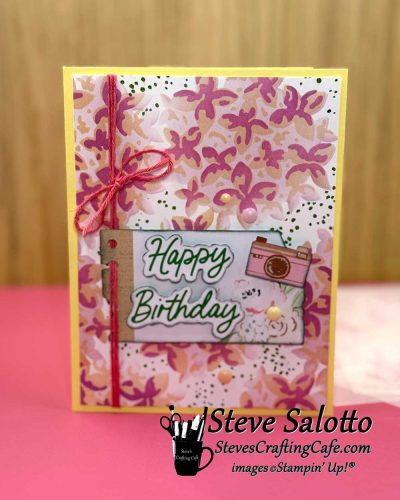A Happy Birthday card with ink-blended flowers on the background.